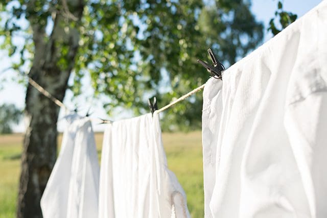 A close up of clothes hanging on a line