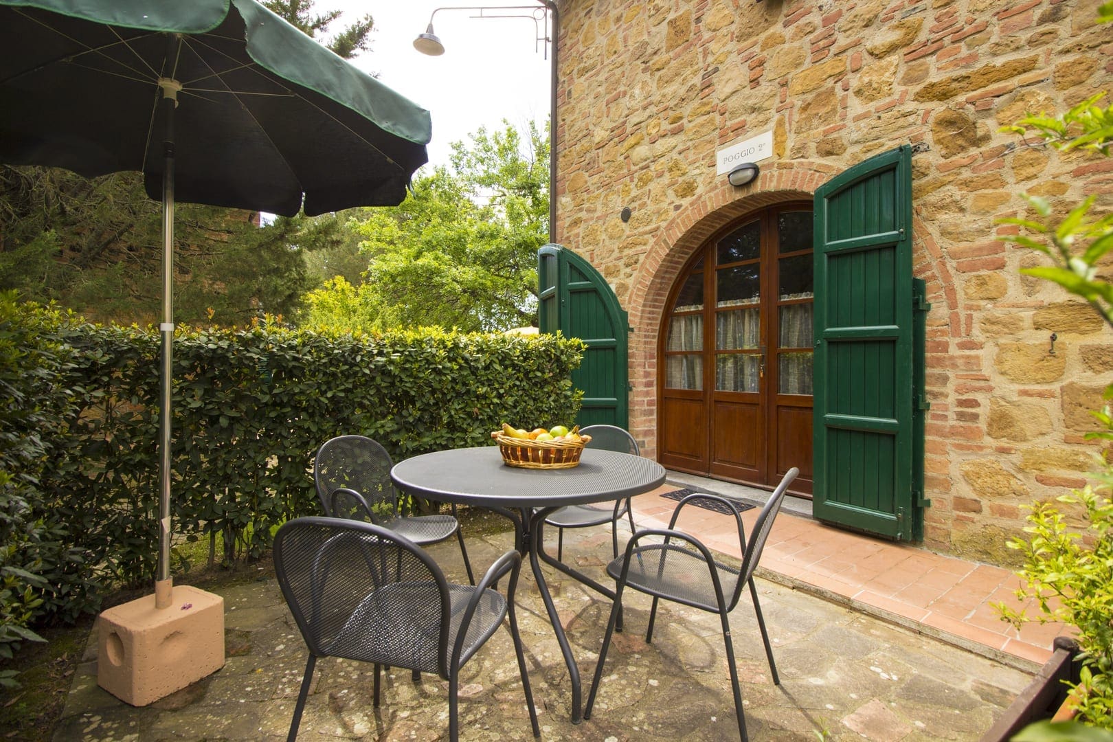 A table and chairs outside of a building