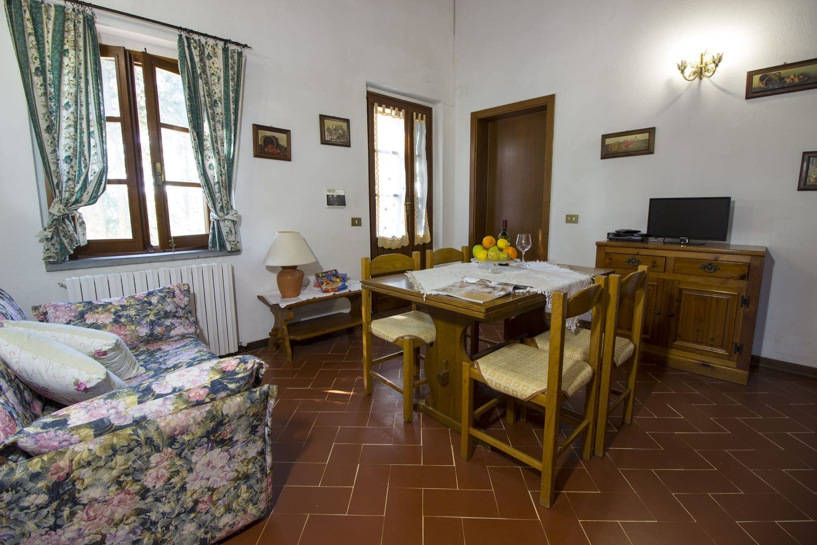 A living room with a table and chairs