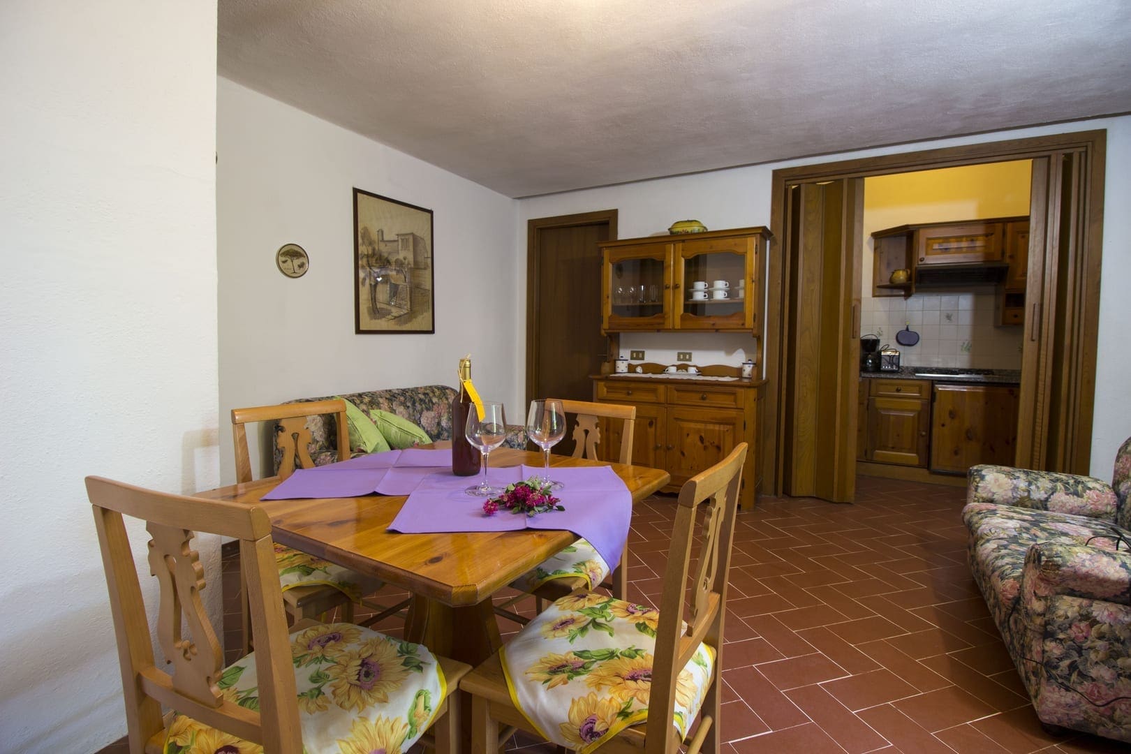 A dining room with wooden table and chairs