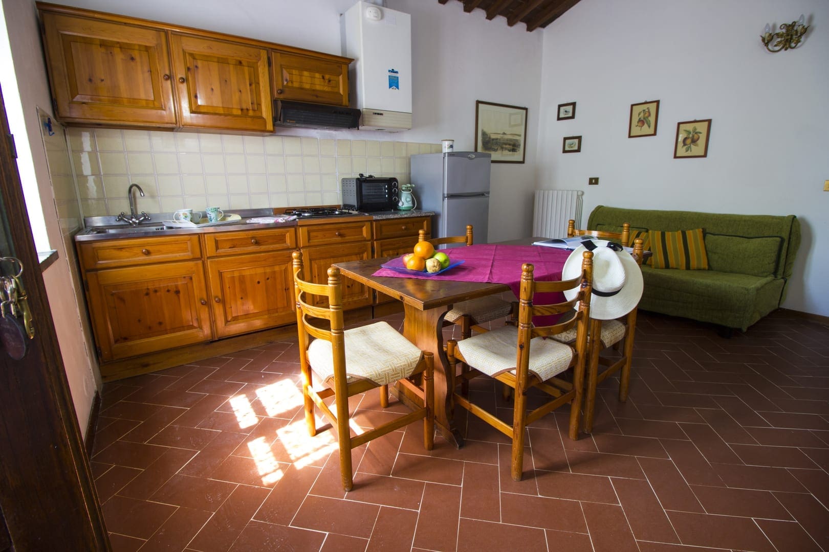 A kitchen with a table and chairs in it